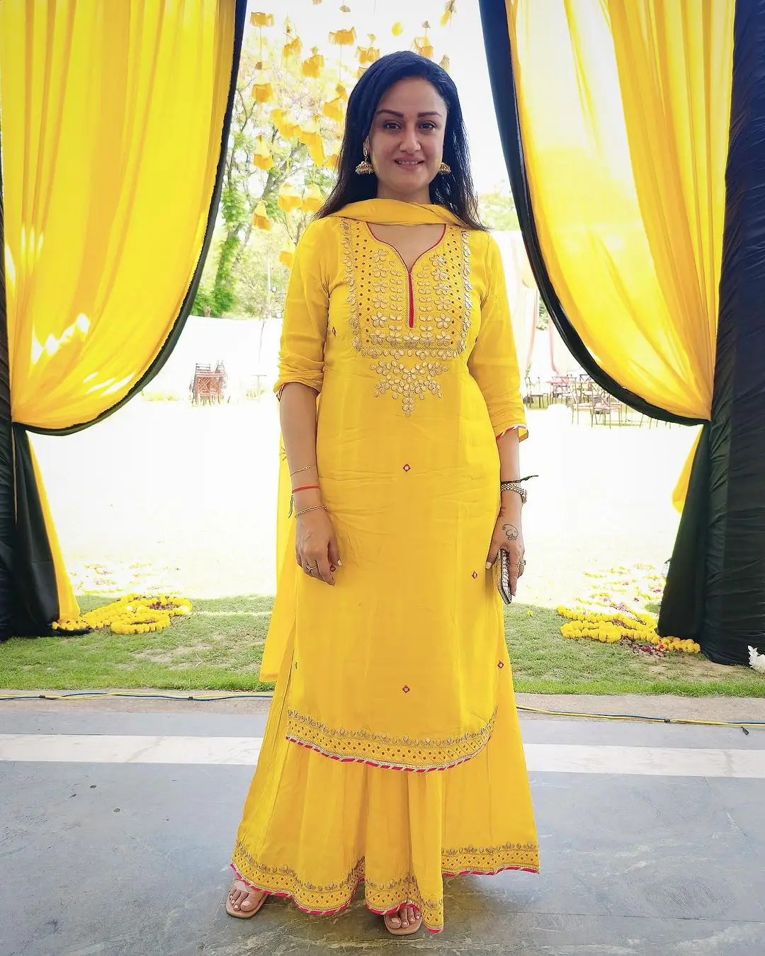 SONIA AGARWAL STILLS IN YELLOW GOWN